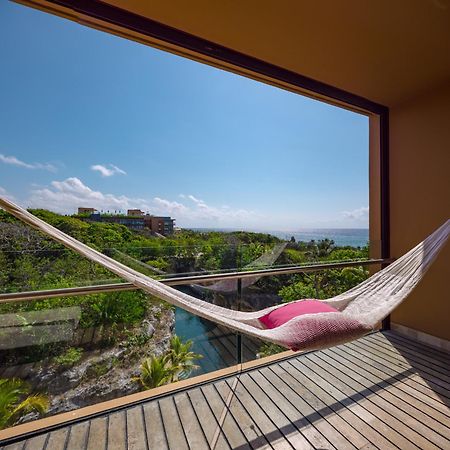 Hotel Xcaret Mexico All Parks All Fun Inclusive (Adults Only) Los Dos Compadres Exterior photo Hammock on a balcony