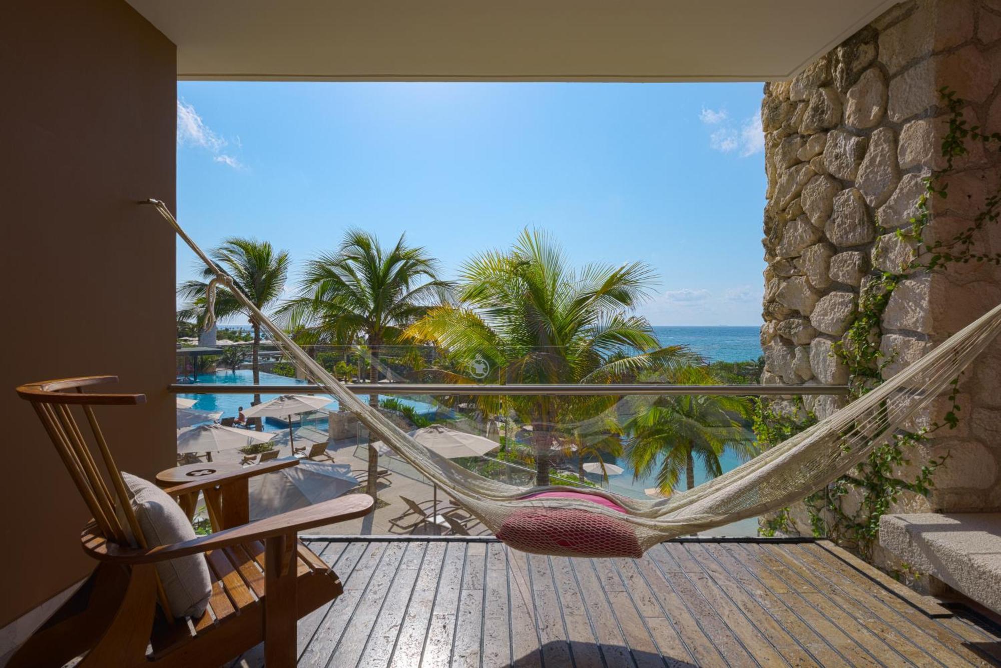 Hotel Xcaret Mexico All Parks All Fun Inclusive (Adults Only) Los Dos Compadres Exterior photo Hammock on a balcony